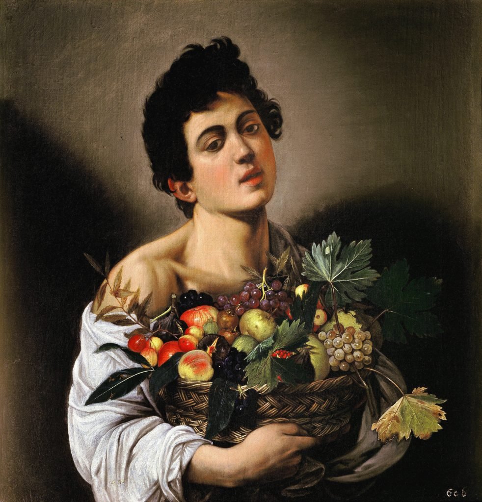 A boy with a basket of fruit, seated against a dark background.