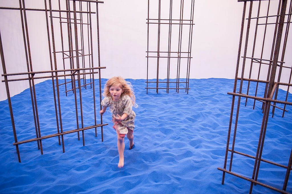 A child plays on artist Flaka Haliti's installation in the Kosovo Pavilion at the Arsenale, Venice Biennale. May 2015. Photo by Romano Cagnoni/Getty Images.