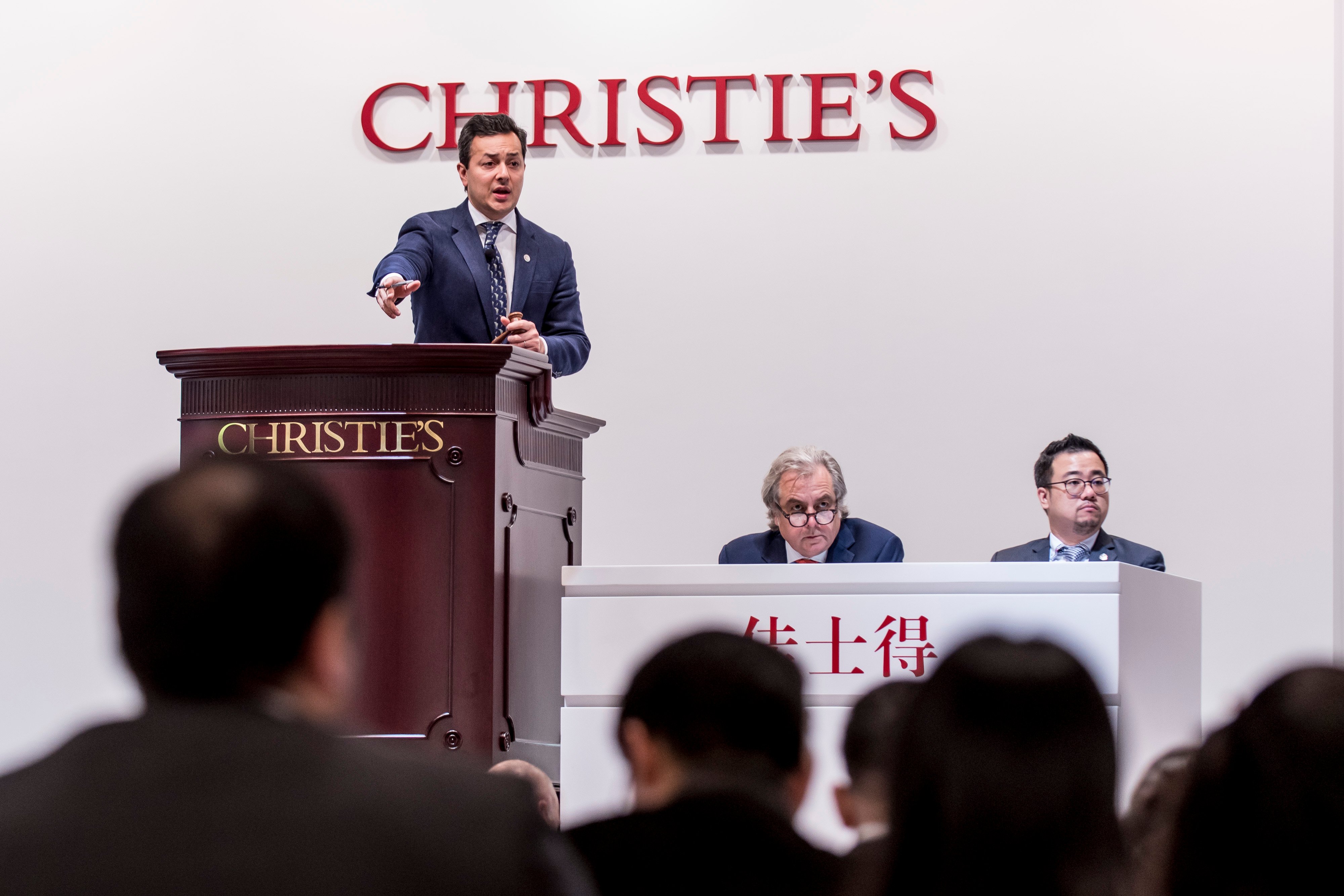Christie's auctioneer Rahul Kadakia takes bids at Christie's Hong Kong. (Photo by Keith Tsuji/Getty Images for Stephen Silver)