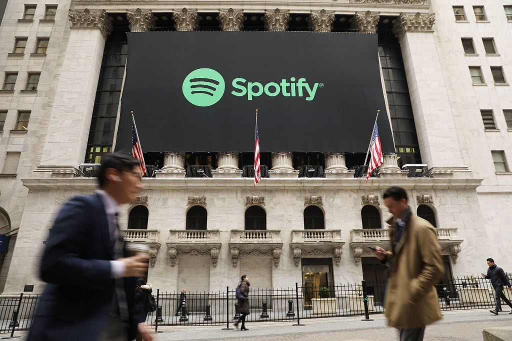 The Spotify banner hangs from the New York Stock Exchange (NYSE) on the morning that the music streaming service begins trading shares.(Photo by Spencer Platt/Getty Images)