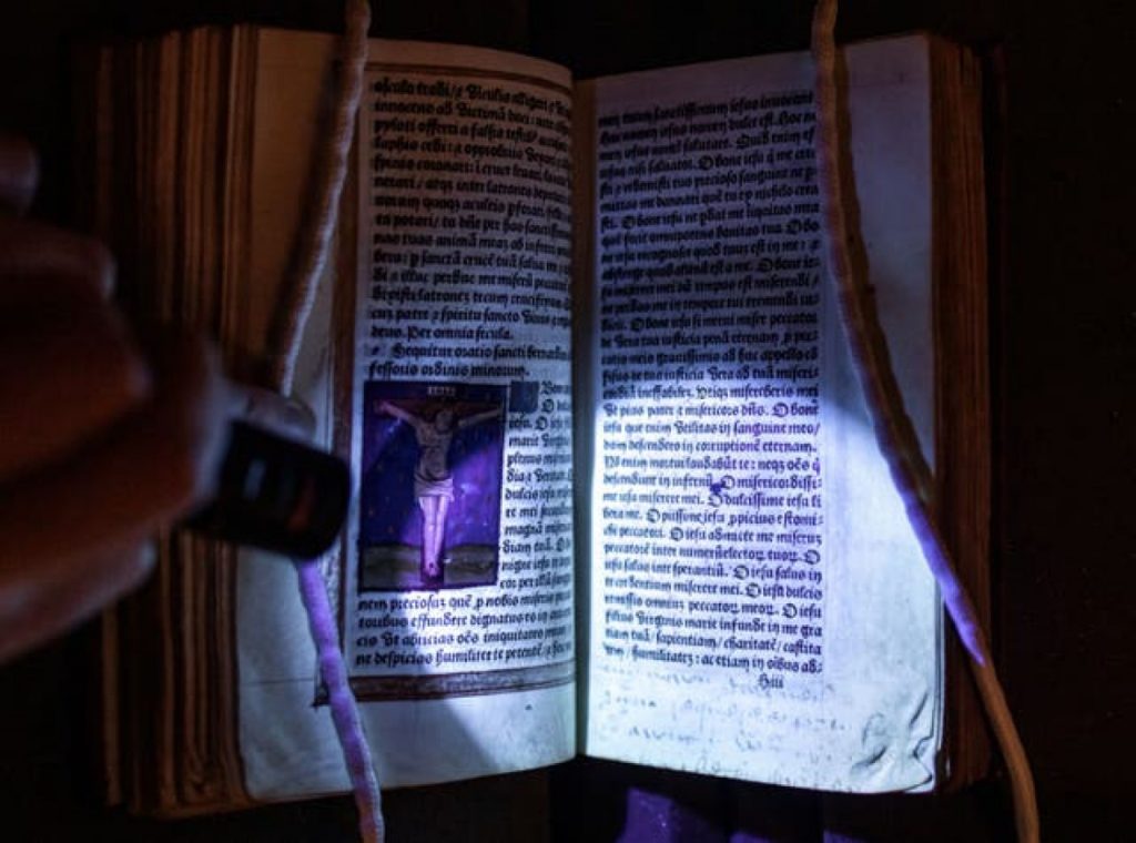 The hidden words and names in Anne Boleyn’s Book of Hours prayer book revealed by ultra-violet light. Photo courtesy of Hever Castle & Garden.