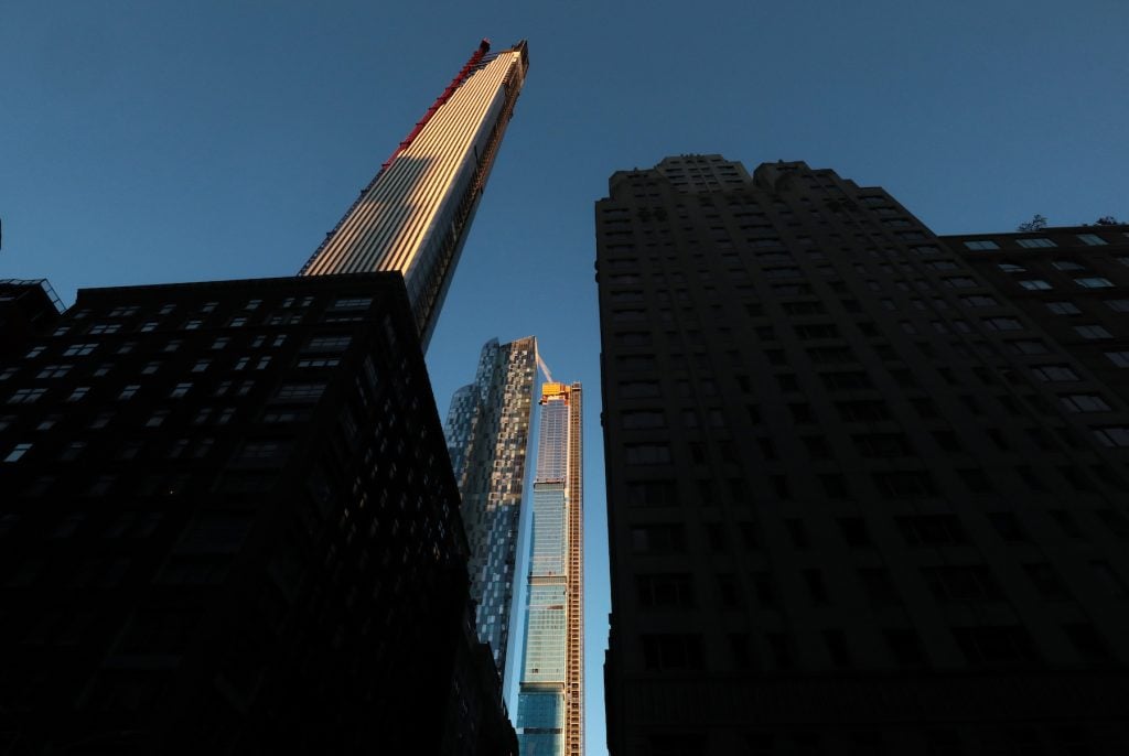 The sun rises on 111 West 57th Street also known as it is under construction on November 2, 2019, in New York City. (Photo by Gary Hershorn/Getty Images)