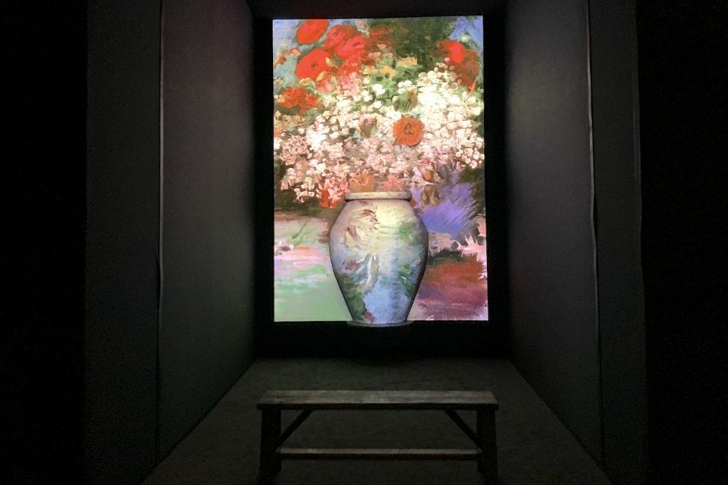A giant sculptural vase with Van Gogh images projected on it at "Van Gogh: The Immersive Experience." Photo by Ben Davis.
