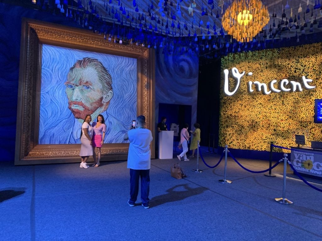 An enormous Van Gogh self-portrait greets visitors to "Immersive Van Gogh." Photo by Ben Davis.