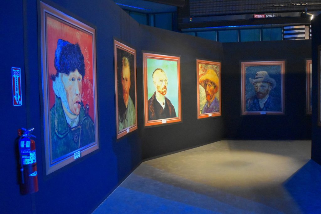Display of replica Van Gogh self-portraits at "Van Gogh: The Immersive Experience." Photo by Ben Davis.
