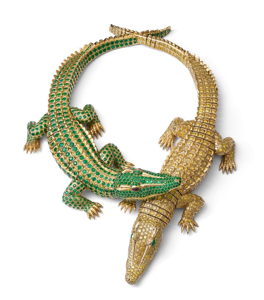 According to legend, when actress María Félix commissioned this necklace, she carried live baby crocodiles into Cartier in Paris to serve as models for the design. The realistic sculpting of the gold includes the scutes of a crocodile’s skin. There are 60.02-carats of fancy intense yellow diamonds and 66.86-carats of emeralds in the setting. Photo by Nils Herrmann, Cartier Collection ©Cartier.