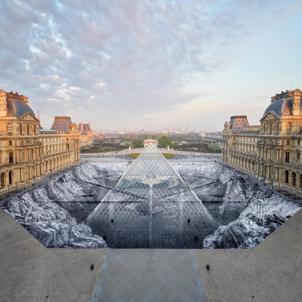 JR's installation at the Louvre in 2019 on the occasion of the pyramid’s 30th anniversary. Photo courtesy of JR-art/Perrotin Gallery.