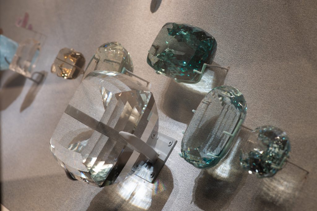 This grouping of topaz gems includes the Brazilian Princess, a 221-facet, 9.5-pound pale blue topaz that once was the largest cut gem in the world. Photo by D. Finnin, ©American Museum of Natural History.