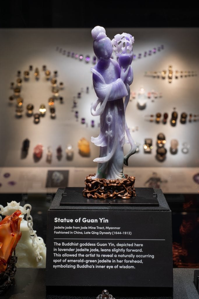 A carving of the Buddhist deity Guan Yin in lavender jadeite jade, fashioned in China during the late Qing Dynasty. Photo by D. Finnin, ©American Museum of Natural History.