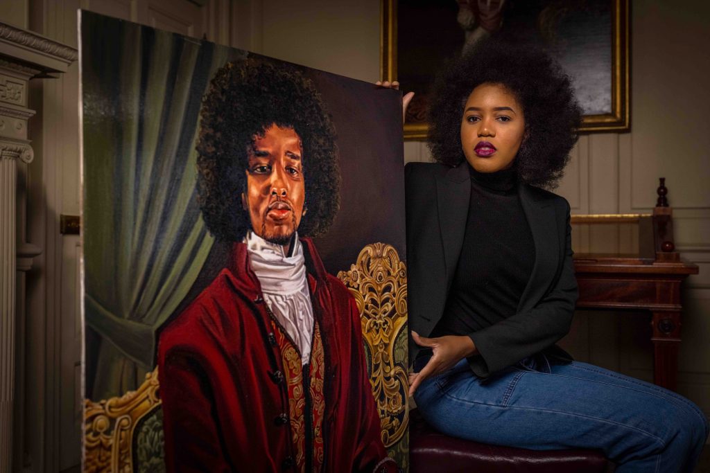 Glory Samjolly with her portrait of James Chappell. Photo by Christopher Ison for English Heritage ©.