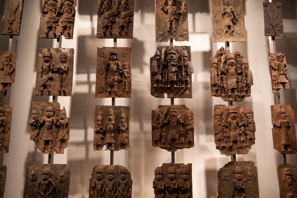 Plaques that form part of the Benin Bronzes are displayed at The British Museum in London, England. Photo: Dan Kitwood/Getty Images.