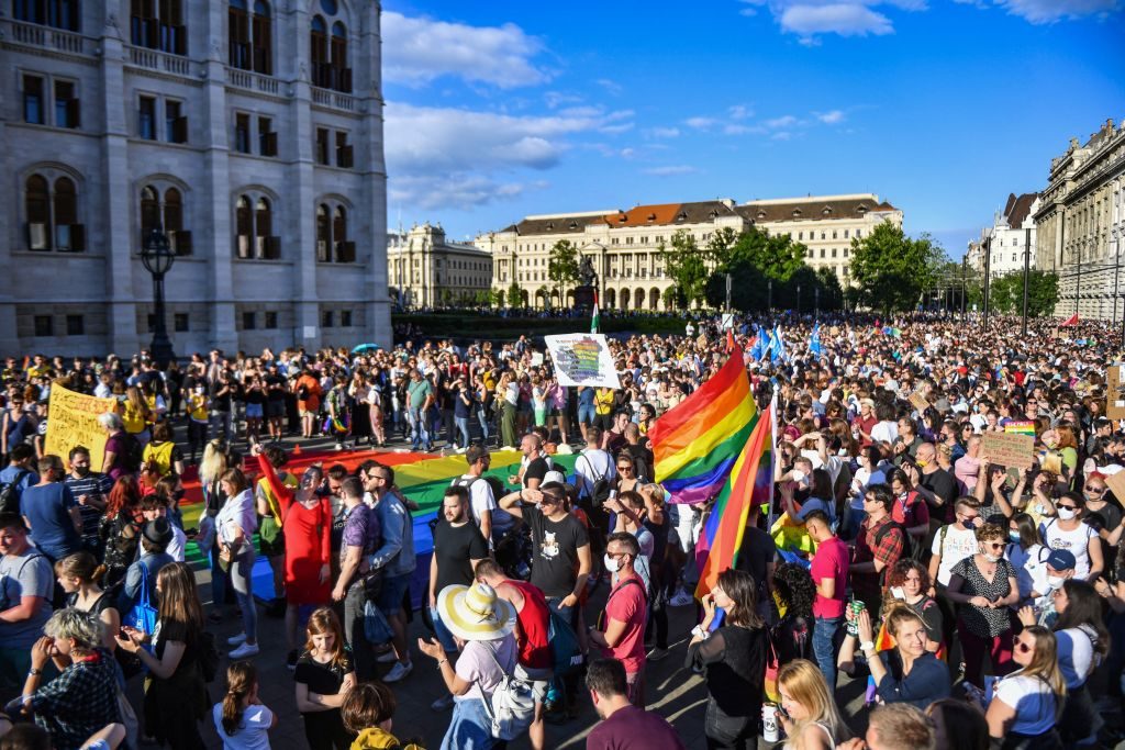 Participants gather near the parliament building in Budapest on June 14, 2021, during a demonstration against the Hungarian government's draft bill seeking to ban the "promotion" of homosexuality and sex changes. Photo by Gergeley Besenyei/AFP via Getty Images.