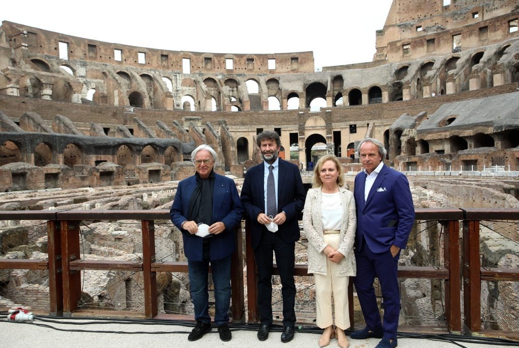 [From left] Diego della Valle; Dario Franceschini,Italian mminister Culture; Alfonsine Russo, director of the Parco archeologico del Colosseo; and Andrea Della Valle, during the presentation of the works on the underground area of the Colosseum. Photo: Marco Ravagli/Barcroft Media via Getty Images.