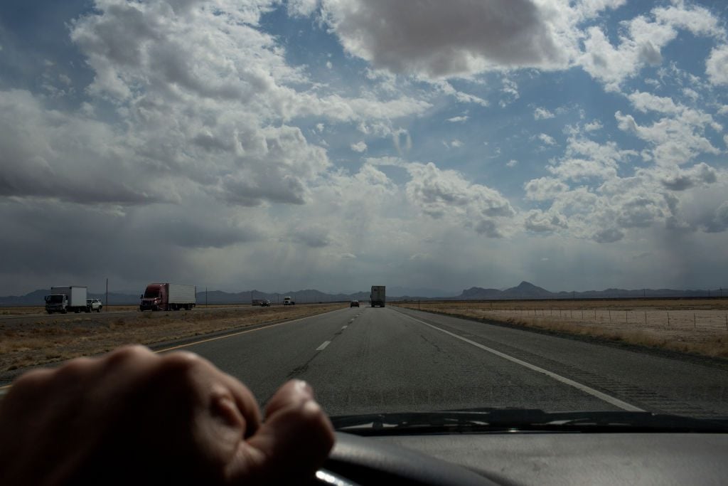 Driving west across the desert and mountains. (Photo by Andrew Lichtenstein/Corbis via Getty Images)