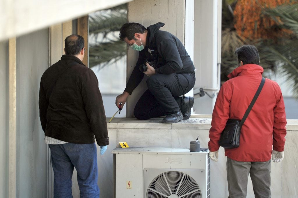 Police investigators search for evidence at the Athens' National Gallery on January 9, 2012, after artworks were stolen from the gallery overnight, police said. . Photo: Louisa Gouliamaki/AFP PHOTO /Getty Images.