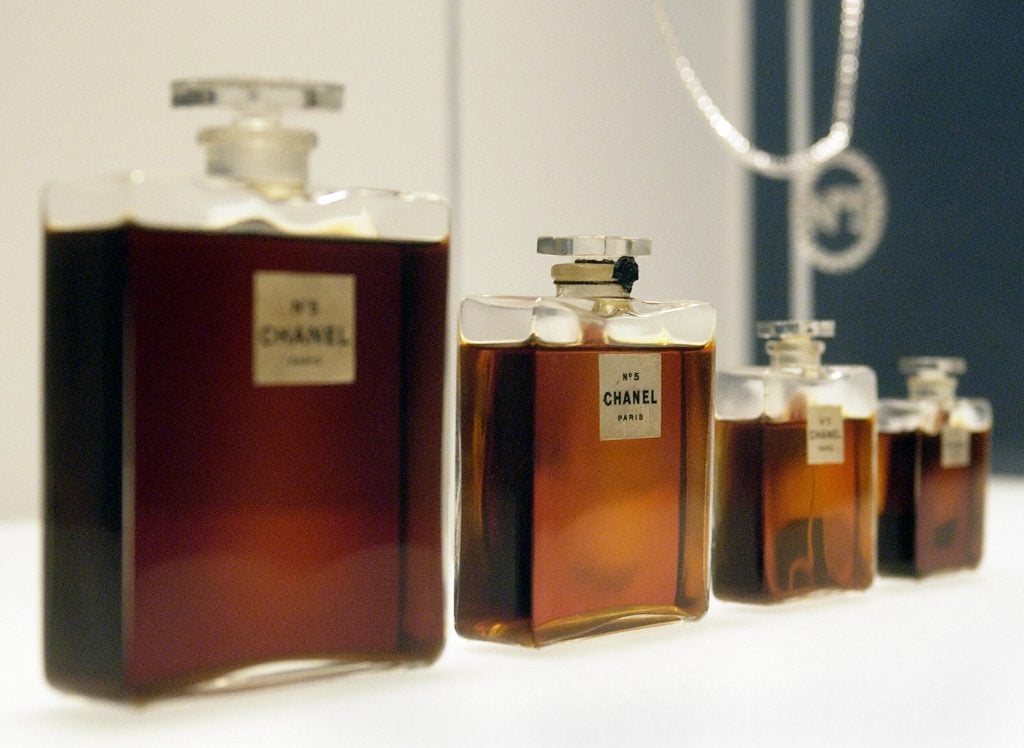 Four bottles of Chanel No. 5 perfume by Gabrielle Chanel from 1921 at the Metropolitan Museum of Art in 2005. Photo courtesy Getty Images.