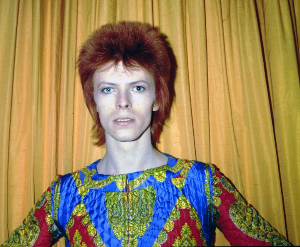 David Bowie poses for a portrait dressed as Ziggy Stardust in 1973 in New York City. Photo by Michael Ochs Archives/Getty Images.