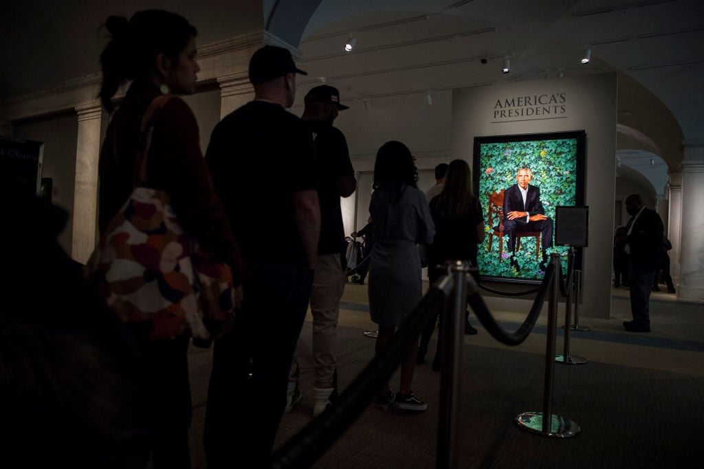 People stand in line to see the commissioned portrait of former President Barack Obama by Kehinde Wiley at the Smithsonian's National Portrait Gallery on February 20, 2018 in Washington, D.C. Photo: Carolyn Van Houten/The Washington Post via Getty Images.