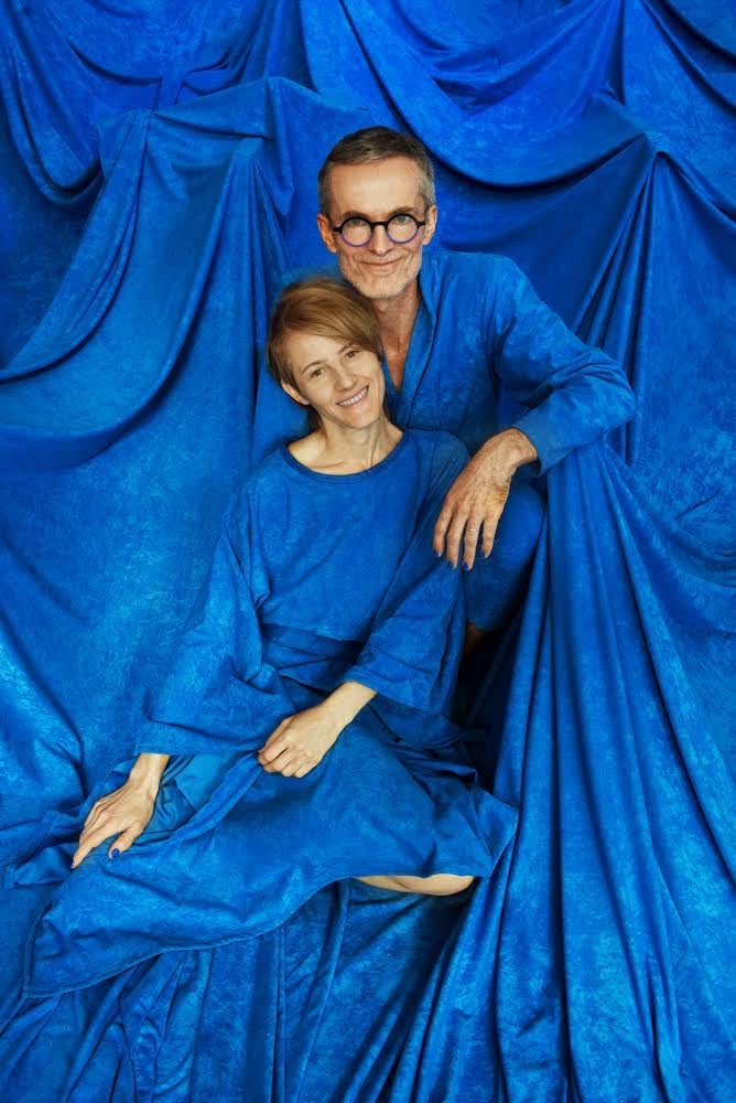 Alois Kronschlaeger and Florencia Minniti with his Kind of Blue installation, wearing the matching garments she made from scraps from the project. Photo by Bob Krasner.