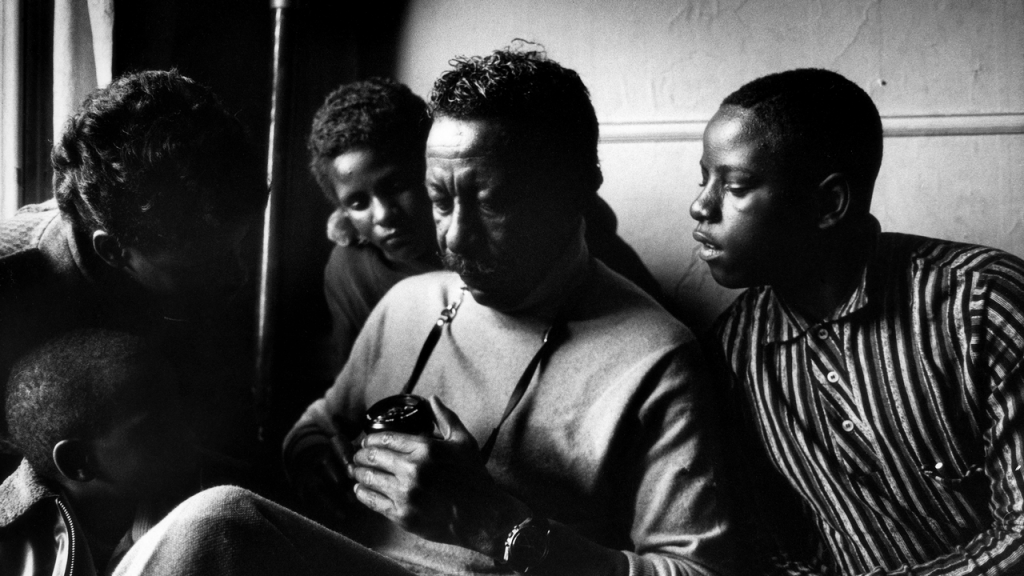 Gordon Parks Jr., <em>Untitled</em> (1967). Gordon Parks photographed with the Fontenelle children, subjects in his series "A Harlem Family," shot for <em>Life</em> magazine. Photo courtesy of the Gordon Parks Foundation.