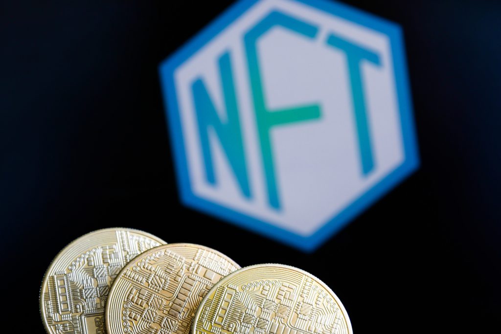 Representation of cryptocurrencies and non-fungible token. (Photo by Jakub Porzycki/NurPhoto via Getty Images)
