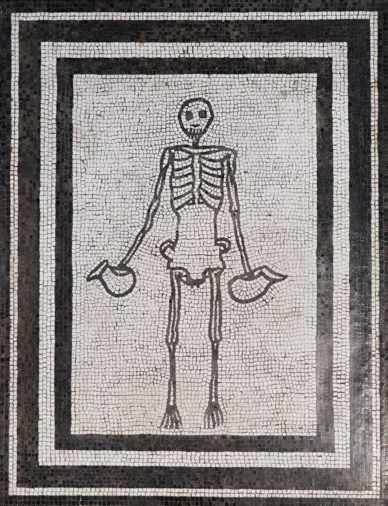 Mosaic of skeleton carrying wine jugs from Pompeii, collection of the Naples Museum. Photo by Marie-Lan Nguyen courtesy of the Fine Arts Museums of San Francisco.