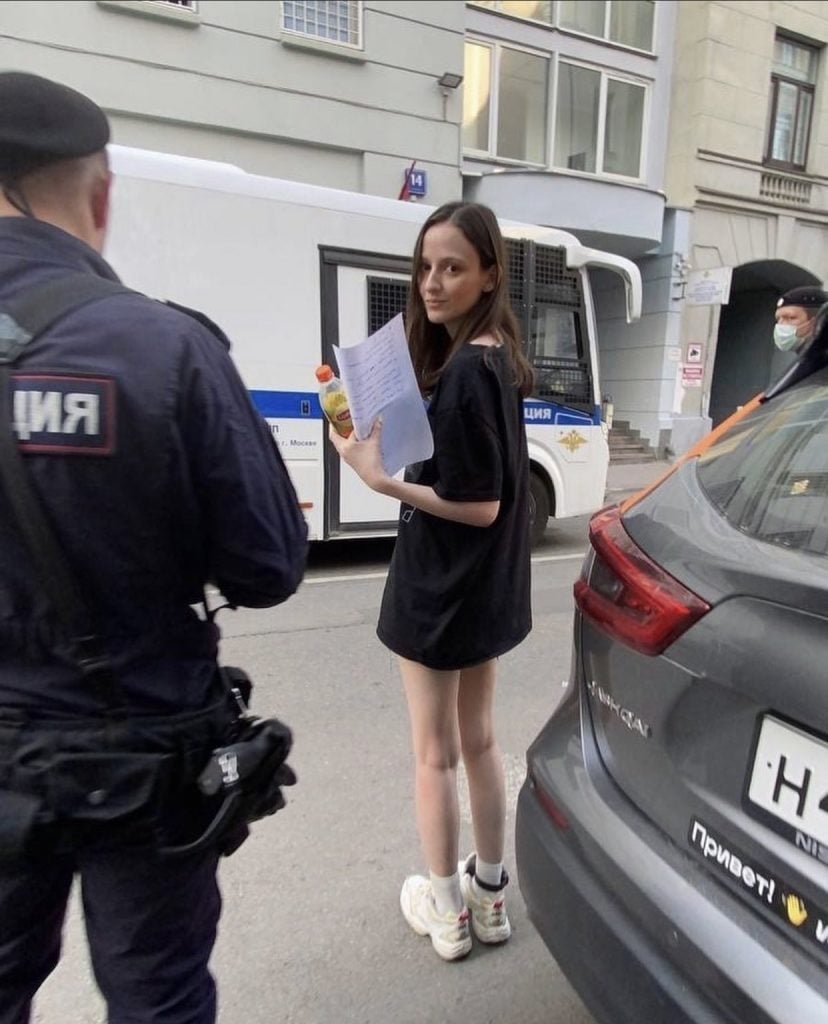 Pussy Riot's Lucy Shtein being detained by Russian police. Photo courtesy of Pussy Riot.