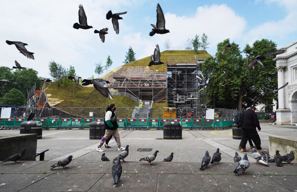 Works continue on the Marble Arch Mound in central London. Photo by Jonathan Brady/PA Images via Getty Images.