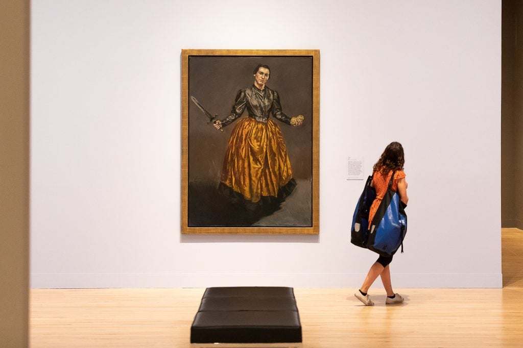A women visits the UK's largest ever retrospective dedicated to Portuguese visual artist Paula Rego at the Tate Britain in London. Photo by Tim P. Whitby/Getty Images.