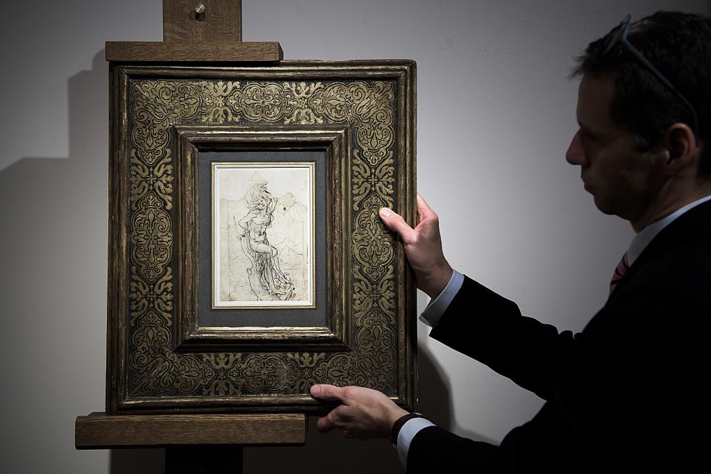 A member of Paris auctioneer Tajan displays a previously undiscovered drawing by Leonardo da Vinci at the auction house in Paris on December 13, 2016. Photo by Philippe Lopez/AFP via Getty Images.