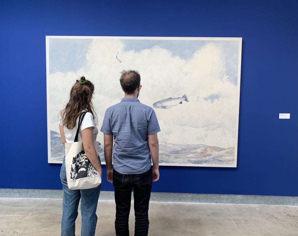 Visitors look at William Allan's Tentative Assault on Mt. Fear (1971) at the di Rosa Center for Contemporary Art in Napa, California. Photo by Sarah Cascone.