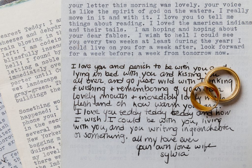 Letters to Ted Hughes from Sylvia Plath, photographed with the couple's wedding rings. Courtesy of Sotheby's.