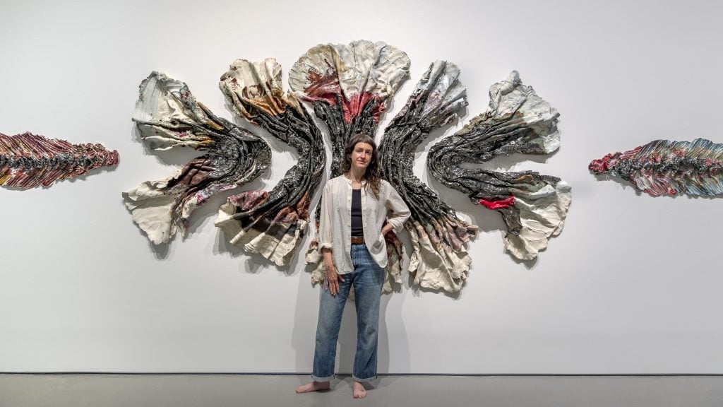 The artist with her work in "Brie Ruais: Movement at the Edge of the Land." Photo by Nash Baker, courtesy of the Moody Center for the Arts, Rice University, Houston; Albertz Benda Gallery, New York; and Night Gallery, Los Angeles.