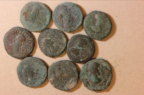A collection of 80 copper staters discoverd by archeologists at the site of the ancient city of Phanagoria. Courtesy of the Russian Academy of Science’s Institute of Archaeology.
