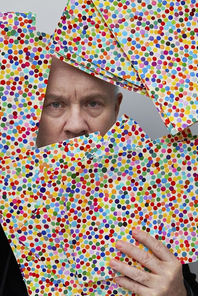 Damien Hirst with works from 