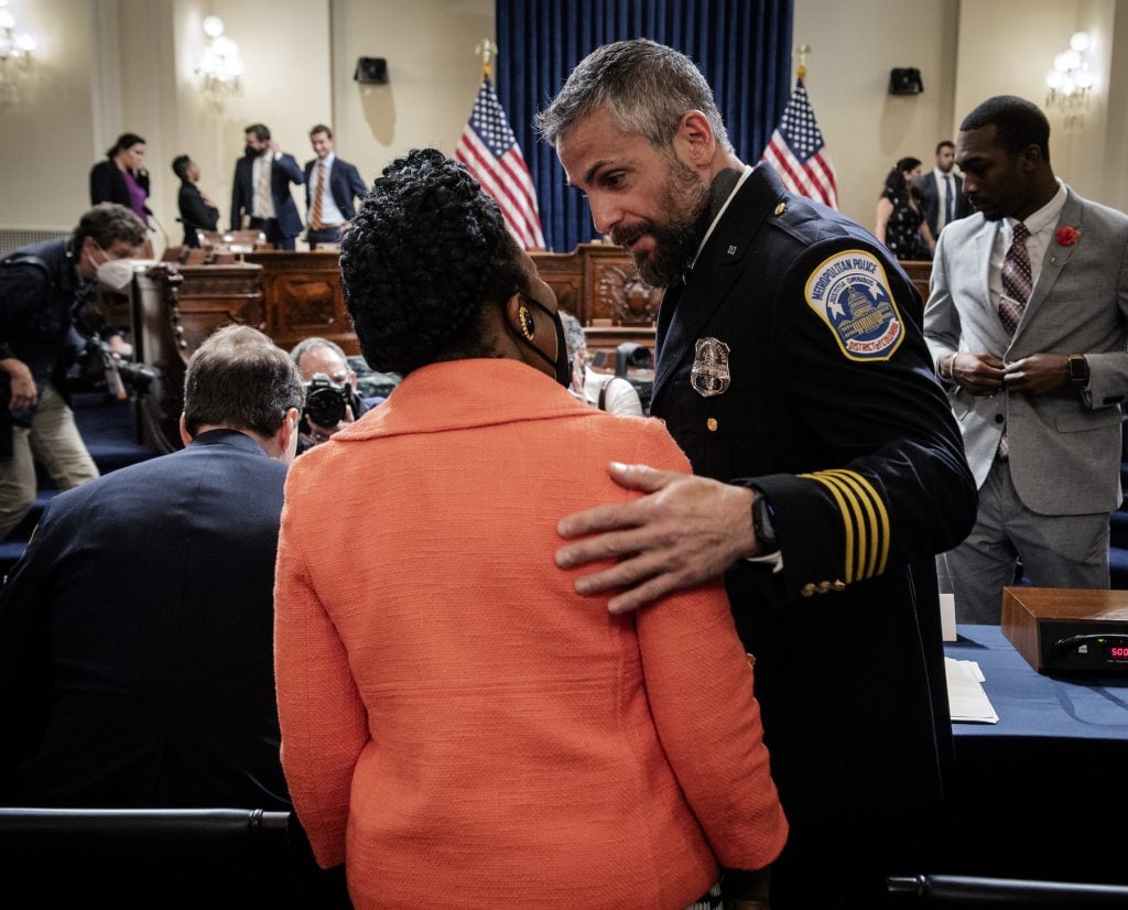 Representative Sheila Jackson-Lee greets MPD officer Michael Fanone before the Congressional Jan 6th commission hearing begins on July 27, 2021 in Washington, DC. Photo by Bill O'Leary - Pool/Getty Images.