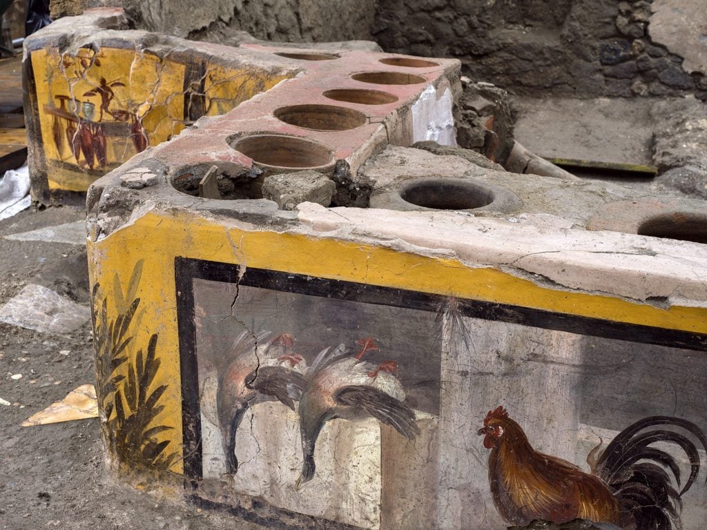 The <em>thermopolium</em>, or fast food restaurant, from Regio V in Pompeii.  Photo courtesy of Pompeii Archaeological Park. “Width =” 1024 “height =” 768 “srcset =” https://news.artnet.com/app/news-upload/2021/08/000AWN1YB6VY9AQU-C0-1024×768. jpeg 1024w, https://news.artnet.com/app/news-upload/2021/08/000AWN1YB6VY9AQU-C0-300×225.jpeg 300w, https://news.artnet.com/app/news-upload/2021/ 08 / 000AWN1YB6VY9AQU-C0-50×38.jpeg 50w “size =” (max-width: 1024px) 100vw, 1024px “/></p>
<p class=