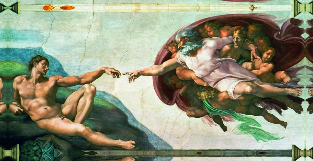 A reproduction of <em>The Creation of Adam" in "Michelangelo’s Sistine Chapel: The Exhibition." Photo courtesy of See Global Entertainment. 