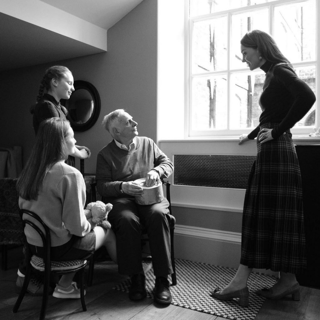 Kate Middleton photographing Holocaust survivor Steven Frank and his two granddaughters, Maggie and Trixie Fleet, at Kensington Palace. Photo courtesy of Kensington Palace.