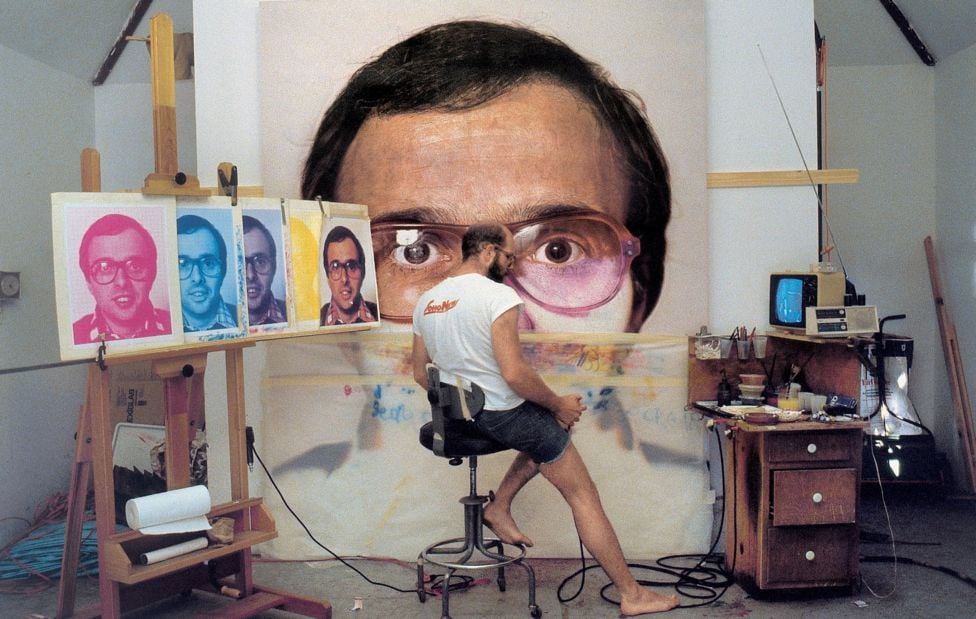 Chuck Close painting in his studio in the 1970s. Photo ©Chuck Close/courtesy of Pace Gallery.