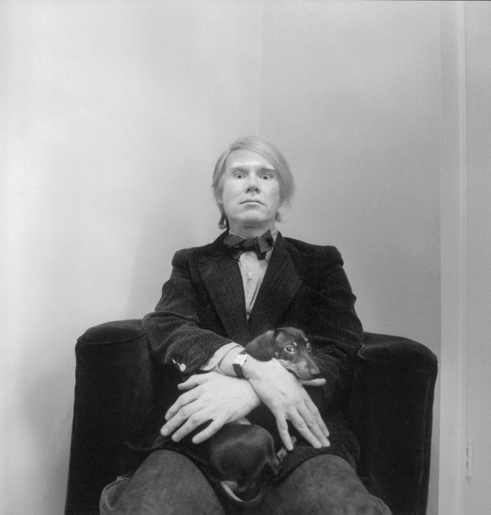 Andy Warhol photographed at his studio in his Tank wristwatch by Arnold Newman in February 1973. © Arnold Newman Properties/Getty Images. Used with the permissions from The Andy Warhol Foundation for the Visual Arts, inc.