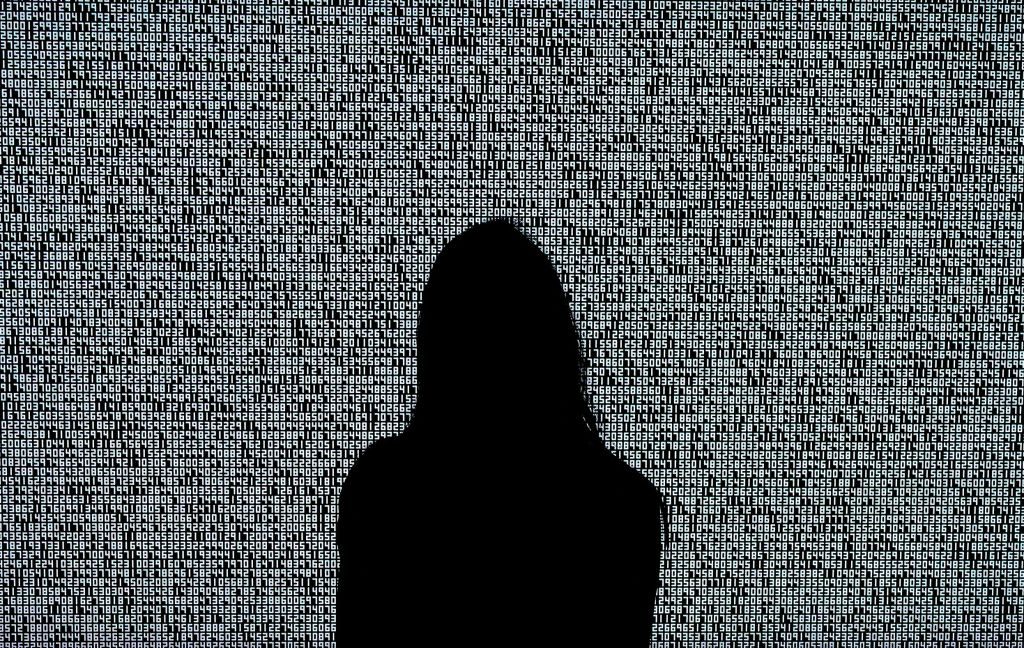 This is a photo of a woman looking at an NFT by Ryoji Ikeda during a Sotheby's preview... but for the purposes of this story, it could be a man with long hair pretending to be a female NFT creator. (Photo by TIMOTHY A. CLARY/AFP via Getty Images)