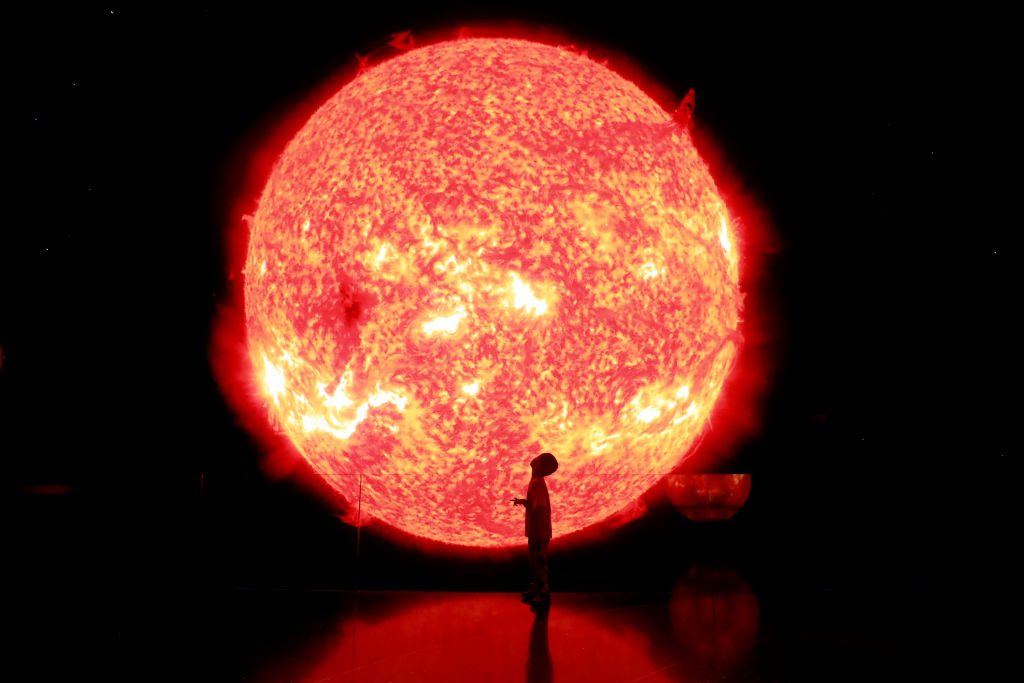 A child watches a model of the sun at the Shanghai Astronomy Museum before its opening on July 5, 2021 in Shanghai, China. Photo: Tang Yanjun/China News Service via Getty Images.