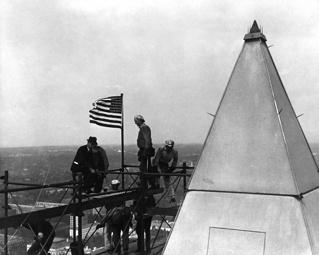 Works Progress Administration workmen install new platinum lightning rods atop the Washington Monument, Washington, DC, 1930s. (Photo by PhotoQuest/Getty Images)