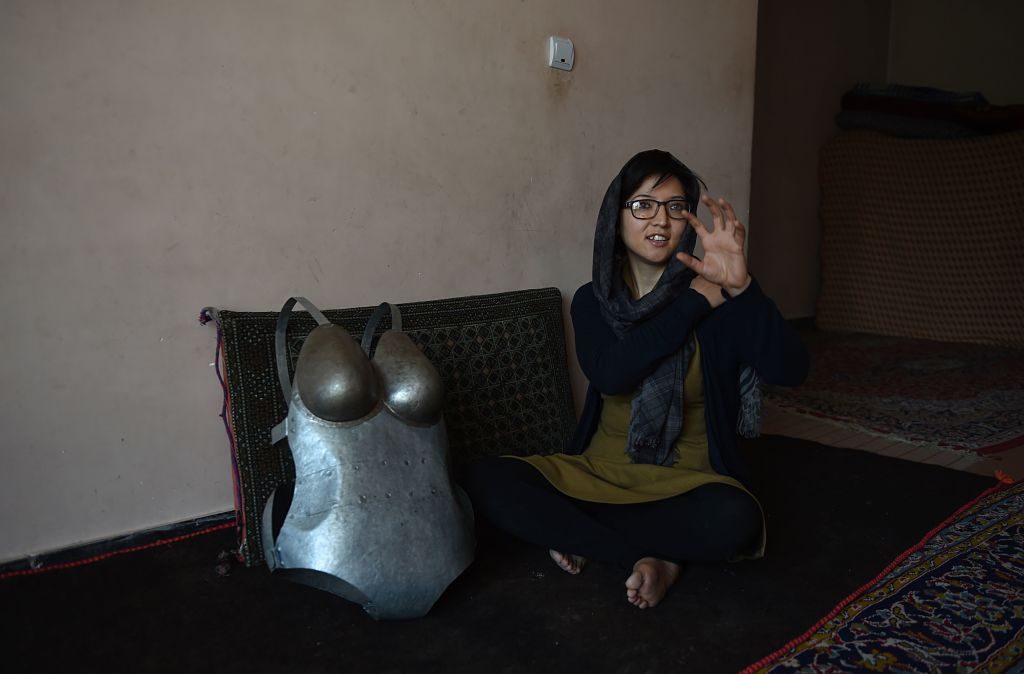 Artist Kubra Khademi back in 2015. She went into hiding after wearing a suit of armour featuring large breasts and buttocks in protest against sexual harassment. She is now based in France. AFP/ Shah Marai via Getty Images.