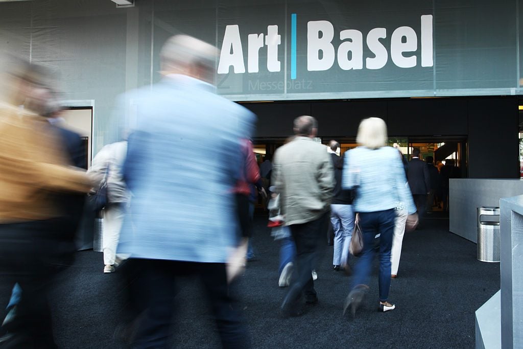 Visitors enter the expositions building during the VIP opening day at Art Basel. Photo by Michele Tantussi/Getty Images.