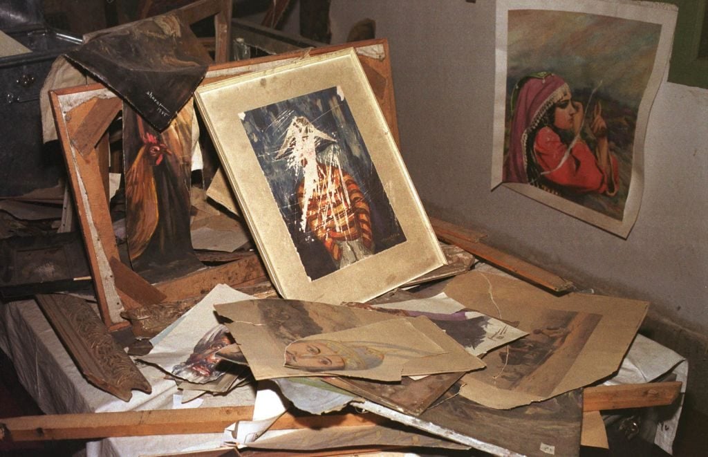 Paintings from the Kabul National Gallery that were shredded by the Taliban are preserved in the city's museum on April 23, 2002. Under the rule of the Taliban, all forms of pictures and imagery were banned. (Photo by Kaveh Kazemi/Getty Images)