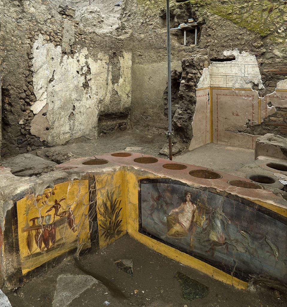 The <em>thermopolium</em>, or fast food restaurant, from Regio V in Pompeii.  Photo courtesy of the Pompeii Archaeological Park. “Width =” 958 “height =” 1024 “srcset =” https://news.artnet.com/app/news-upload/2021/08/IPA_IPA22869582-958×1024.jpeg 958w , https: //news.artnet.com/app/news-upload/2021/08/IPA_IPA22869582-281×300.jpeg 281w, https://news.artnet.com/app/news-upload/2021/08/IPA_IPA22869582- 47×50.  jpeg 47w “size =” (max-width: 958px) 100vw, 958px “/></p>
<p class=