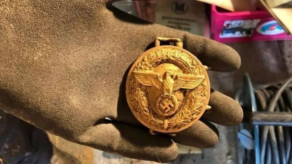 A local history teacher has discovered a secret cache of items, including this  belt buckle, belonging to the local office of the Nationalsozialistische Volkswohlfahrt, or NSV, a Nazi welfare agency. Photo courtesy of the Stadtarchiv Hagen. 