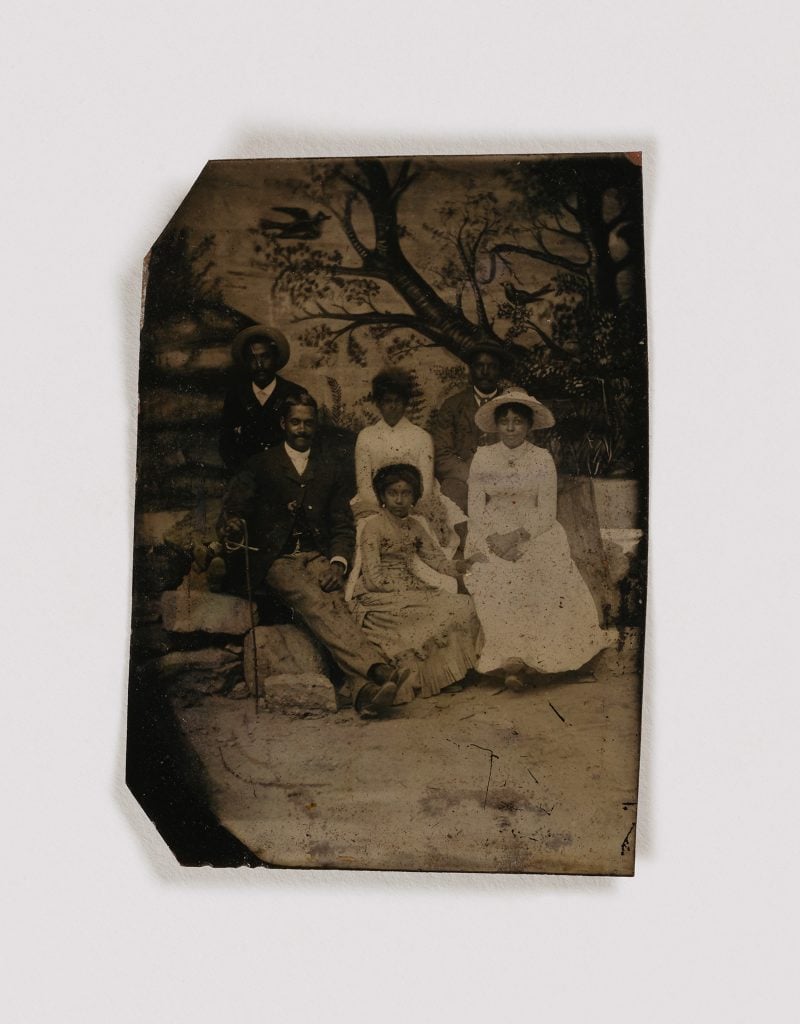 Unidentified artist, Untitled (family, painted backdrop) undated, tintype. Courtesy of the Smithsonian American Art Museum.